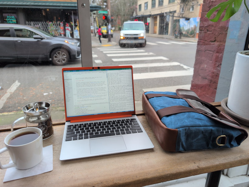 bag with Framework 13 at a cafe